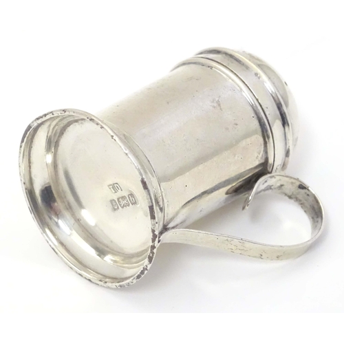 483 - A silver pepper formed as a flour shaker with loop handle. Hallmarked Birmingham 1901 maker Thomas D... 