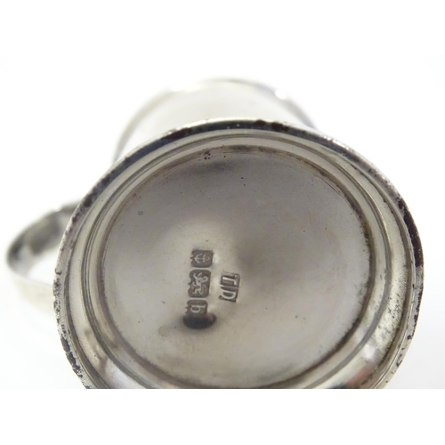 483 - A silver pepper formed as a flour shaker with loop handle. Hallmarked Birmingham 1901 maker Thomas D... 