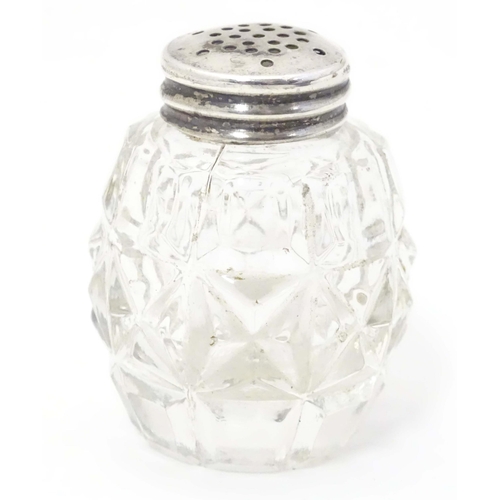 490 - A glass pepper pot with lid marked Sterling Silver 2