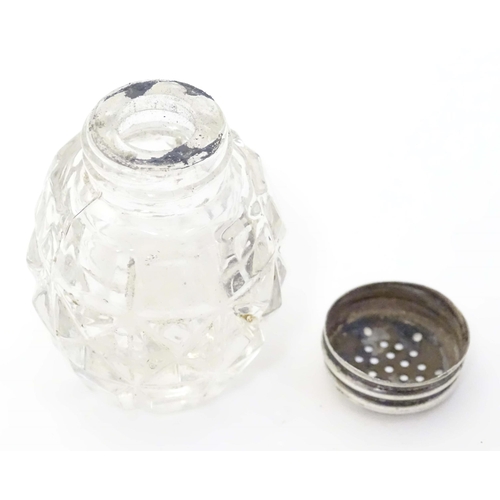 490 - A glass pepper pot with lid marked Sterling Silver 2