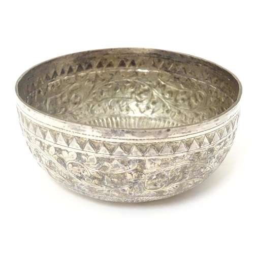 491 - A white metal bowl with acanthus scroll detail, possibly Indian. Approx. 4 1/2