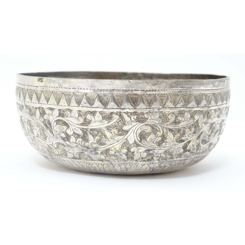 491 - A white metal bowl with acanthus scroll detail, possibly Indian. Approx. 4 1/2