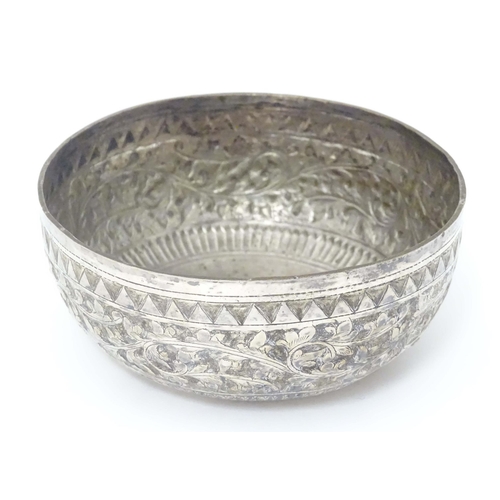 491 - A white metal bowl with acanthus scroll detail, possibly Indian. Approx. 4 1/2