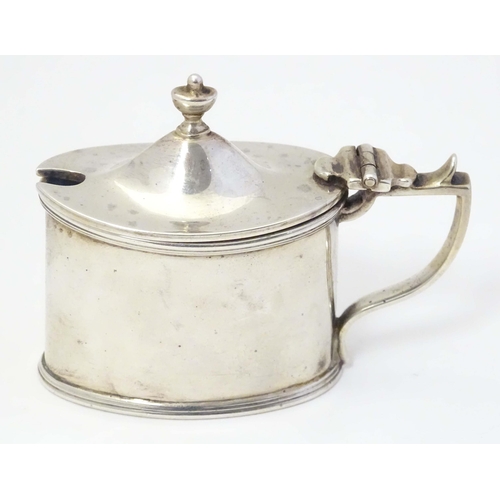 499 - A silver mustard pot of neo classical design with blue glass liner. Hallmarked Chester 1902 maker Ha... 