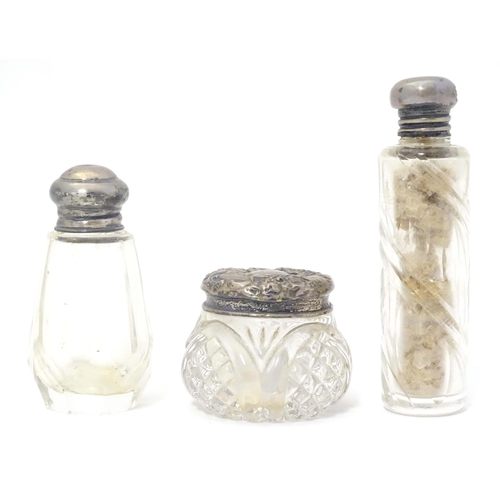 505 - Two small silver lidded glass scent / perfume bottles hallmarked London 1904 makers Henry Perkins & ... 