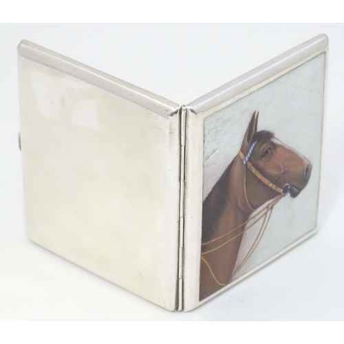 508 - A Continental .900 silver cigarette case with horse head enamel detail. marked 900 and Indistinct ma... 