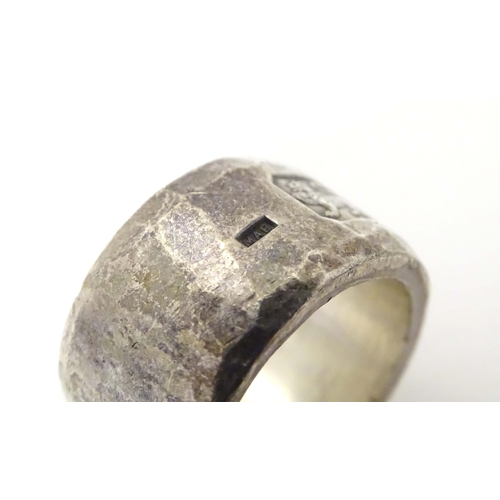 586A - A silver dress ring with hammered detail, hallmarked 1985, maker Michael Allen Bolton. Ring size app... 