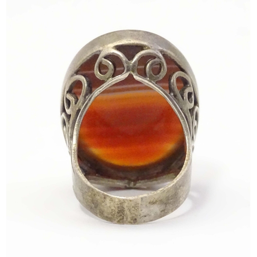 602 - A silver dress ring set with agate cabochon. Hallmarked London 1974 maker GP