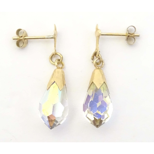 648A - A pair of 9ct gold drop earrings set with facet cut stones. Approx. 1