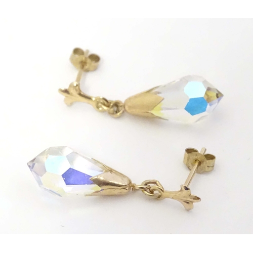 648A - A pair of 9ct gold drop earrings set with facet cut stones. Approx. 1