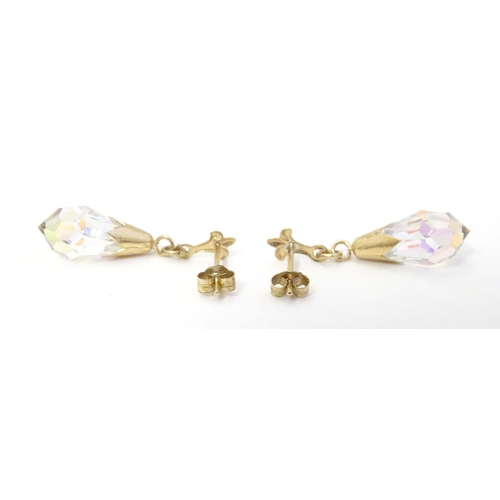 648A - A pair of 9ct gold drop earrings set with facet cut stones. Approx. 1