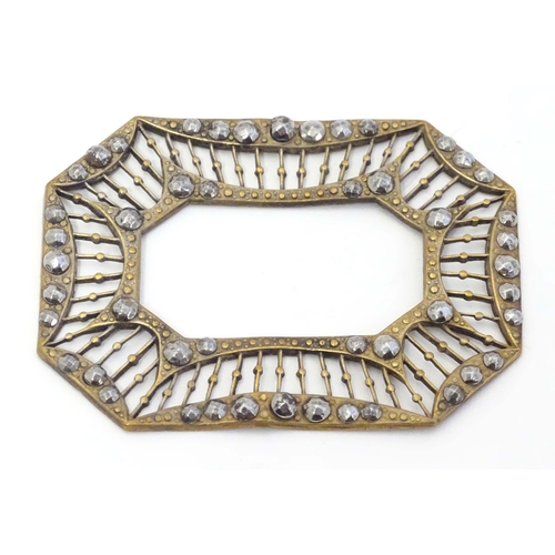 651 - A Victorina gilt metal buckle surround with marcasite decoration. Approx. 2 3/4