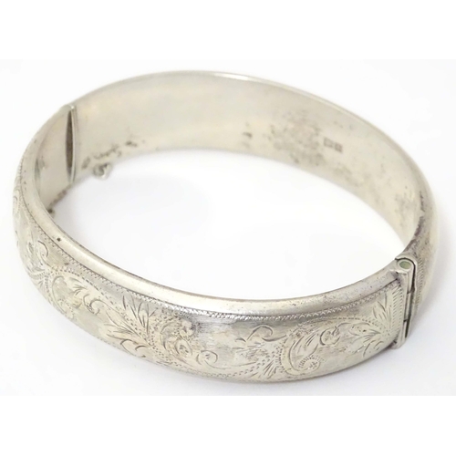 702 - A silver bangle formed bracelet hallmarked  Birmingham 1959 maker E Lilley & Co