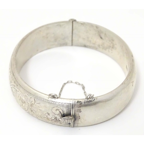 702 - A silver bangle formed bracelet hallmarked  Birmingham 1959 maker E Lilley & Co