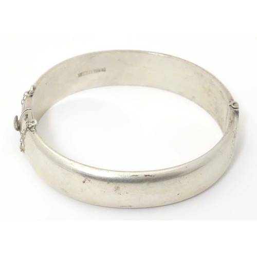 702 - A silver bangle formed bracelet hallmarked  Birmingham 1959 maker E Lilley & Co