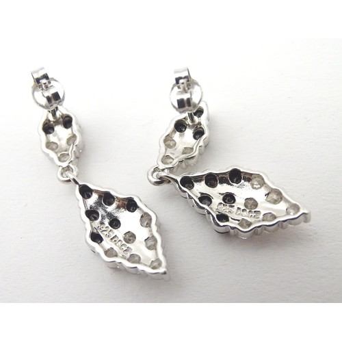 727 - A pair of silver drop earrings set with cubic Zirconia and black stones 1 1/2