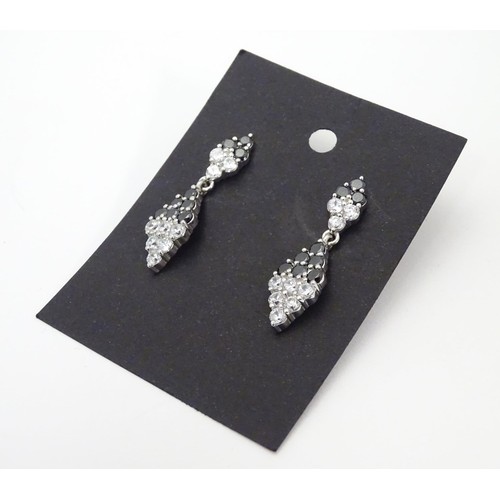 727 - A pair of silver drop earrings set with cubic Zirconia and black stones 1 1/2