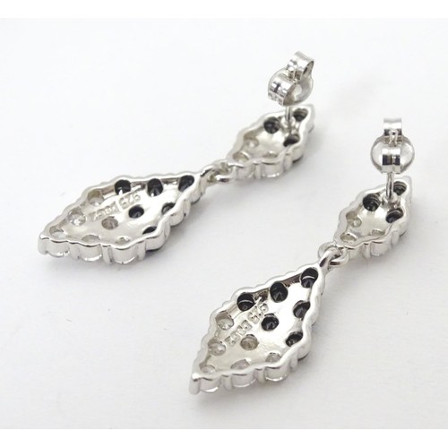 727 - A pair of silver drop earrings set with cubic Zirconia and black stones 1 1/2