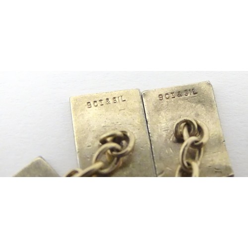 730 - A pair of silver gilt cufflinks with engine turned decoration.