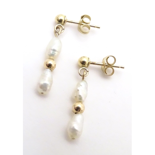 732 - A pair of yellow metal drop earrings set with pearls, together with a pair of screw stud earrings (2... 