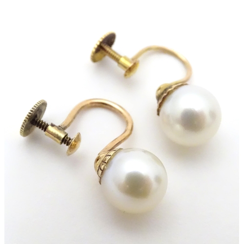 732 - A pair of yellow metal drop earrings set with pearls, together with a pair of screw stud earrings (2... 