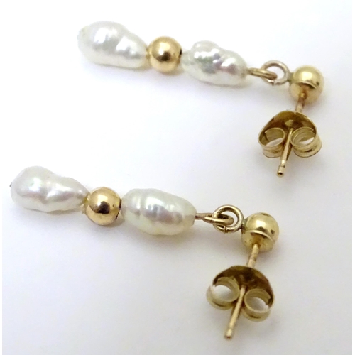 732 - A pair of yellow metal drop earrings set with pearls, together with a pair of screw stud earrings (2... 