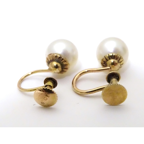 732 - A pair of yellow metal drop earrings set with pearls, together with a pair of screw stud earrings (2... 