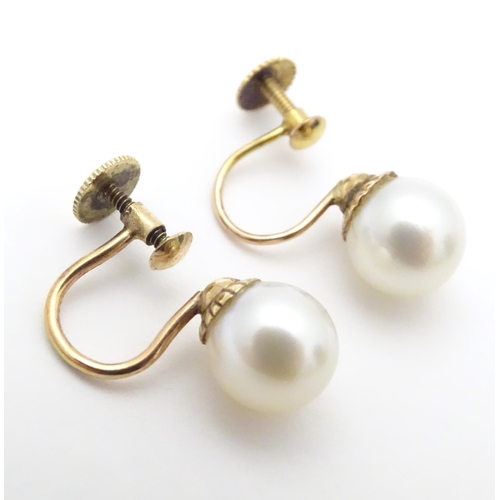 732 - A pair of yellow metal drop earrings set with pearls, together with a pair of screw stud earrings (2... 