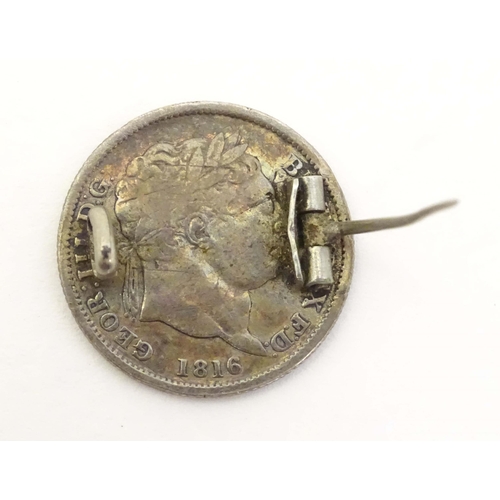 735 - A silver brooch formed from a Geo III 1816 coin with enamel decoration. 1