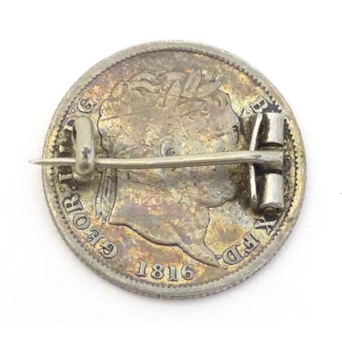 735 - A silver brooch formed from a Geo III 1816 coin with enamel decoration. 1