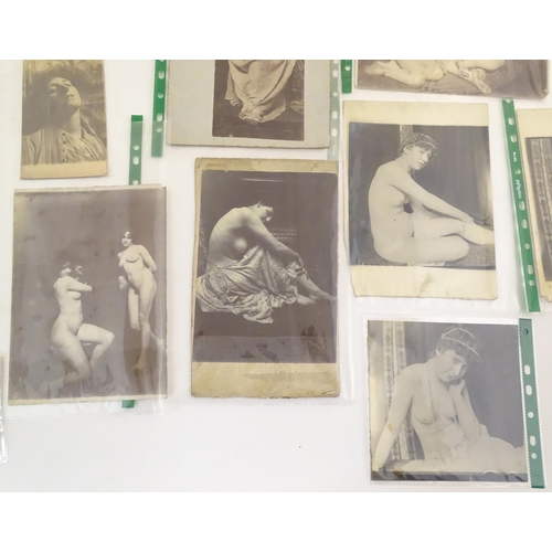 966 - A quantity of late 19th / early 20thC photographs, prints, and postcards depicting portraits, erotic... 