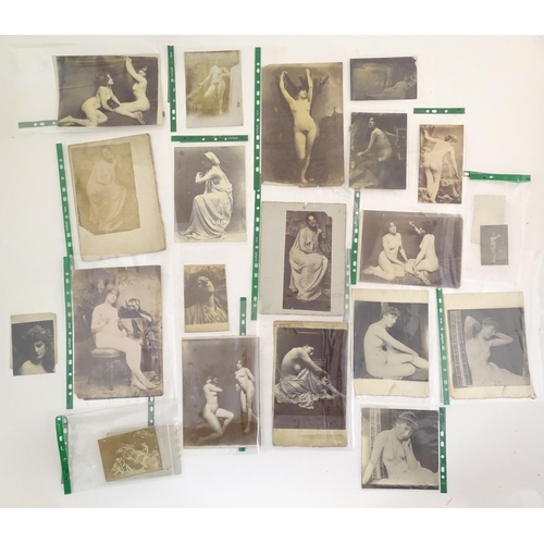 966 - A quantity of late 19th / early 20thC photographs, prints, and postcards depicting portraits, erotic... 