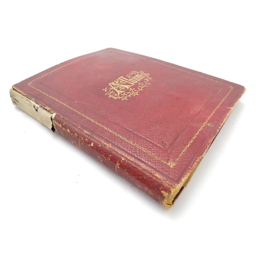 967 - A late 19th / early 20thC album / scrapbook containing various printed / embossed paper monograms, p... 