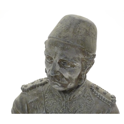 979 - A late 19th / early 20thC cast bust of British General Gordon Pasha (1833-1855) with various badges ... 