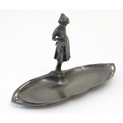 1002 - A WMF Art Nouveau / Jugendstil cast visiting card tray with central young girl, the tray of shaped f... 