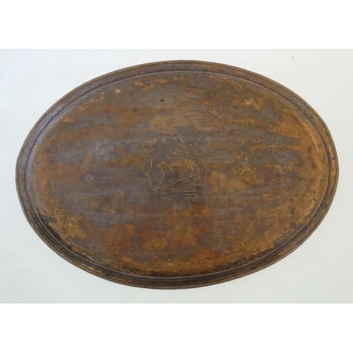 1004 - An Arts & Crafts copper tray of oval form with ship decoration to centre by Hugh Wallis. Stamped wit... 