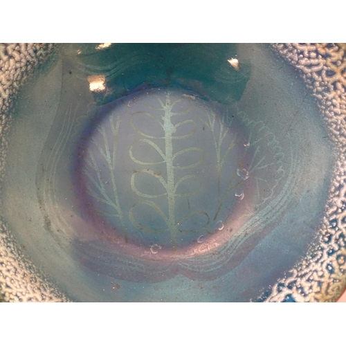 1007 - A 20thC blue enamel bowl by Edward Winter, with stylised foliate decoration. Signed under. Approx. 2... 