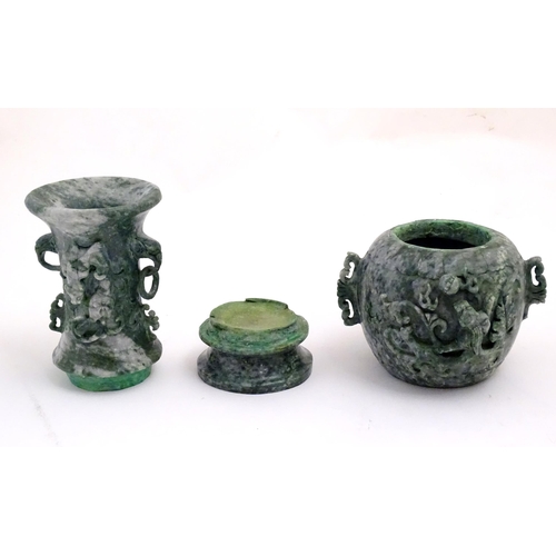 1030 - An Oriental jade coloured soapstone vase of three sectional baluster form decorated with stylised dr... 