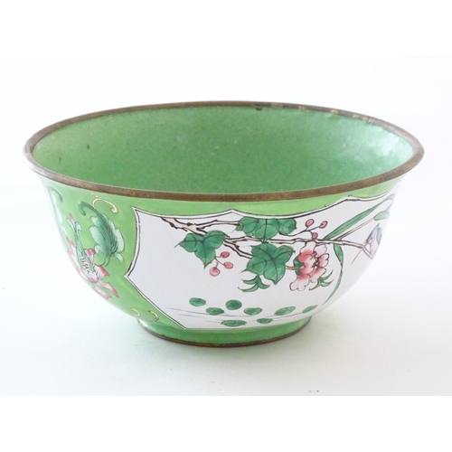 1035 - A Chinese / Cantonese famille verte bowl with enamel detail, decorated with a bird on a peony branch... 