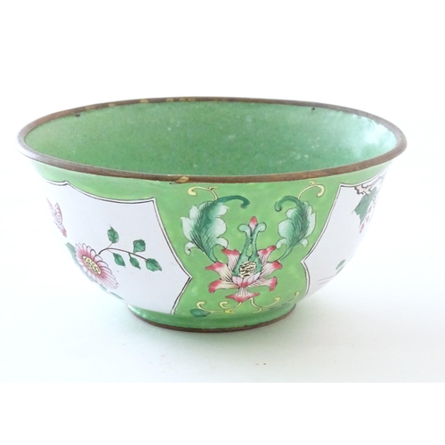 1035 - A Chinese / Cantonese famille verte bowl with enamel detail, decorated with a bird on a peony branch... 