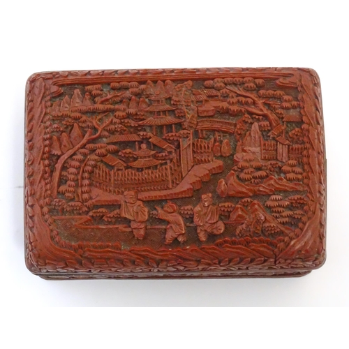 1038 - A Chinese cinnabar lacquer lidded box, the lid with carved detail depicting a landscape scene with t... 