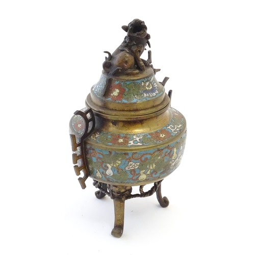 1049 - A Chinese three footed brass censer, the body with enamel decoration depicting birds, flower and fol... 