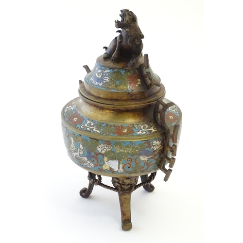 1049 - A Chinese three footed brass censer, the body with enamel decoration depicting birds, flower and fol... 