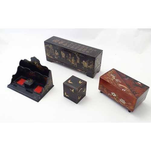 1057 - Four Oriental lacquered items comprising a desk tidy / organiser with shaped back decorated with a w... 