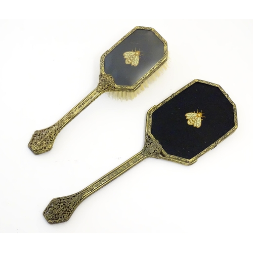 1060 - A 20thC dressing table set with embroidered bee detail, comprising tray, circular dish, hand mirror,... 