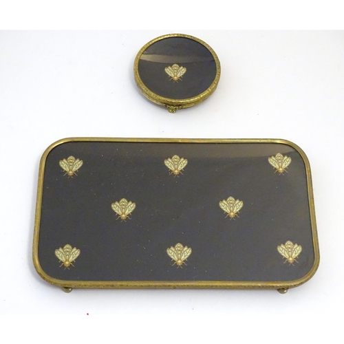 1060 - A 20thC dressing table set with embroidered bee detail, comprising tray, circular dish, hand mirror,... 