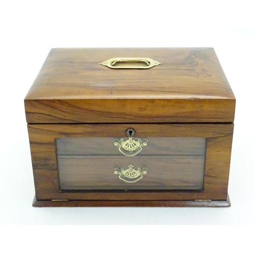 1061 - An early 20thC walnut vanity case / sewing box with fitted lift out tray to interior above two drawe... 