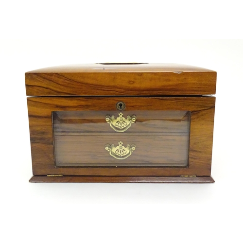 1061 - An early 20thC walnut vanity case / sewing box with fitted lift out tray to interior above two drawe... 