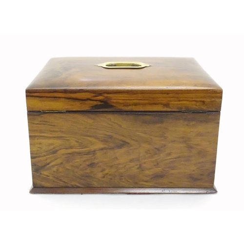 1061 - An early 20thC walnut vanity case / sewing box with fitted lift out tray to interior above two drawe... 