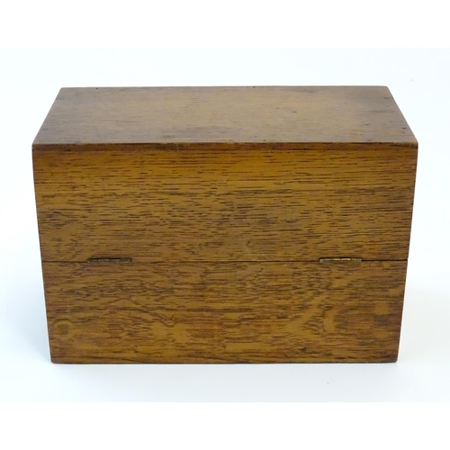 1064 - A 20thC oak correspondence / address box. Approx. 6